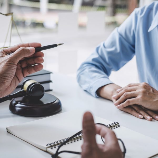 consultation-and-conference-of-male-lawyers-and-professional-businesswoman-working-and-discussion.jpg